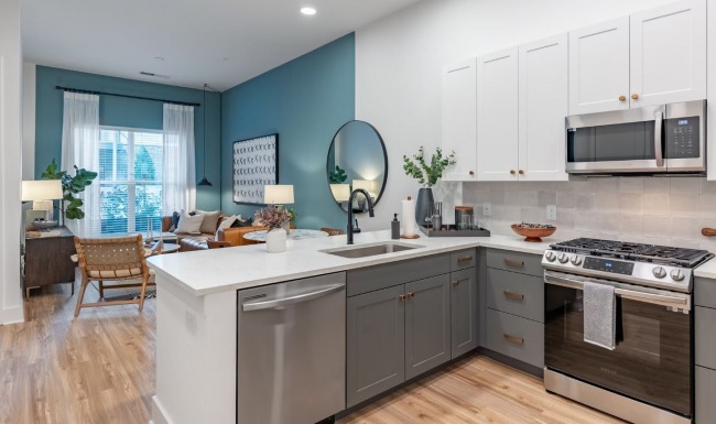 Kitchen and living room at The Boulevard at Grant Park upscale Atlanta apartments